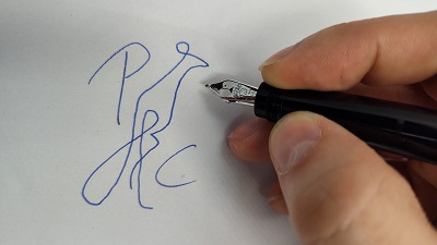 photo of Peafowl Creative logo being written